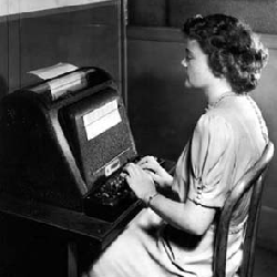 An attendant sends messages to the Model I relay computer.